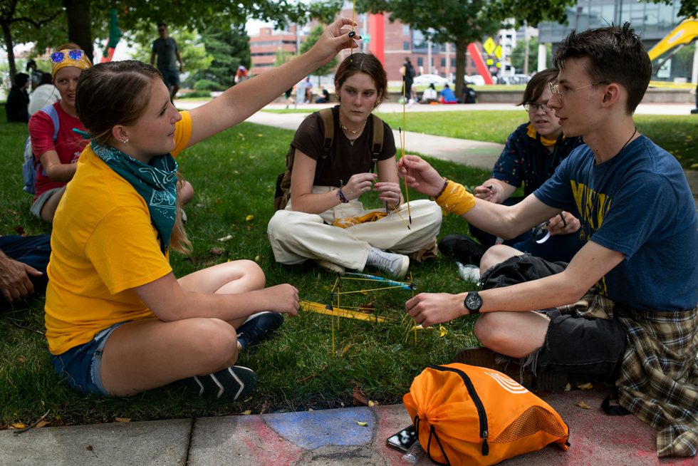 students-on-lawn-calendar-event-240726