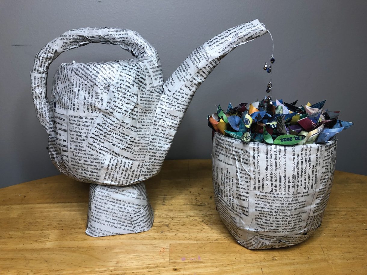 A photograph of a handcrafted watering pot taken by Mya Reiners, an undergraduate in Photography at CCAD.