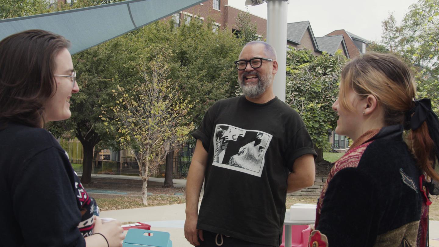Handheld Bryan Lee Omalley laughing with students CXC 2024 topiary park noon frame at 0m3s
